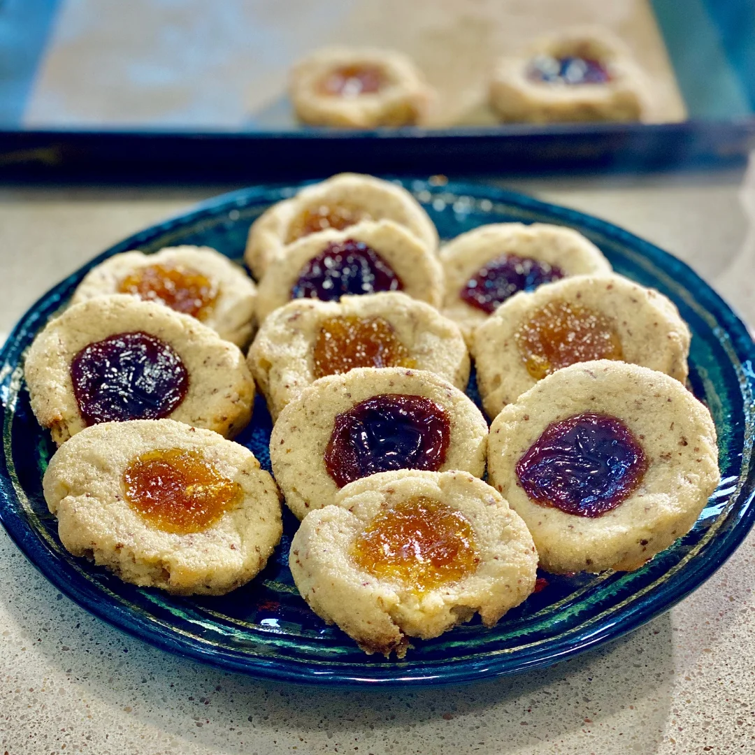 Fingerprint jam cookies on blue plate
