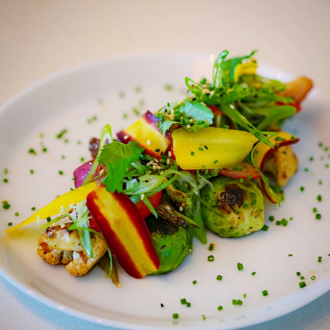 Roasted Brussels sprouts with mango and herbs