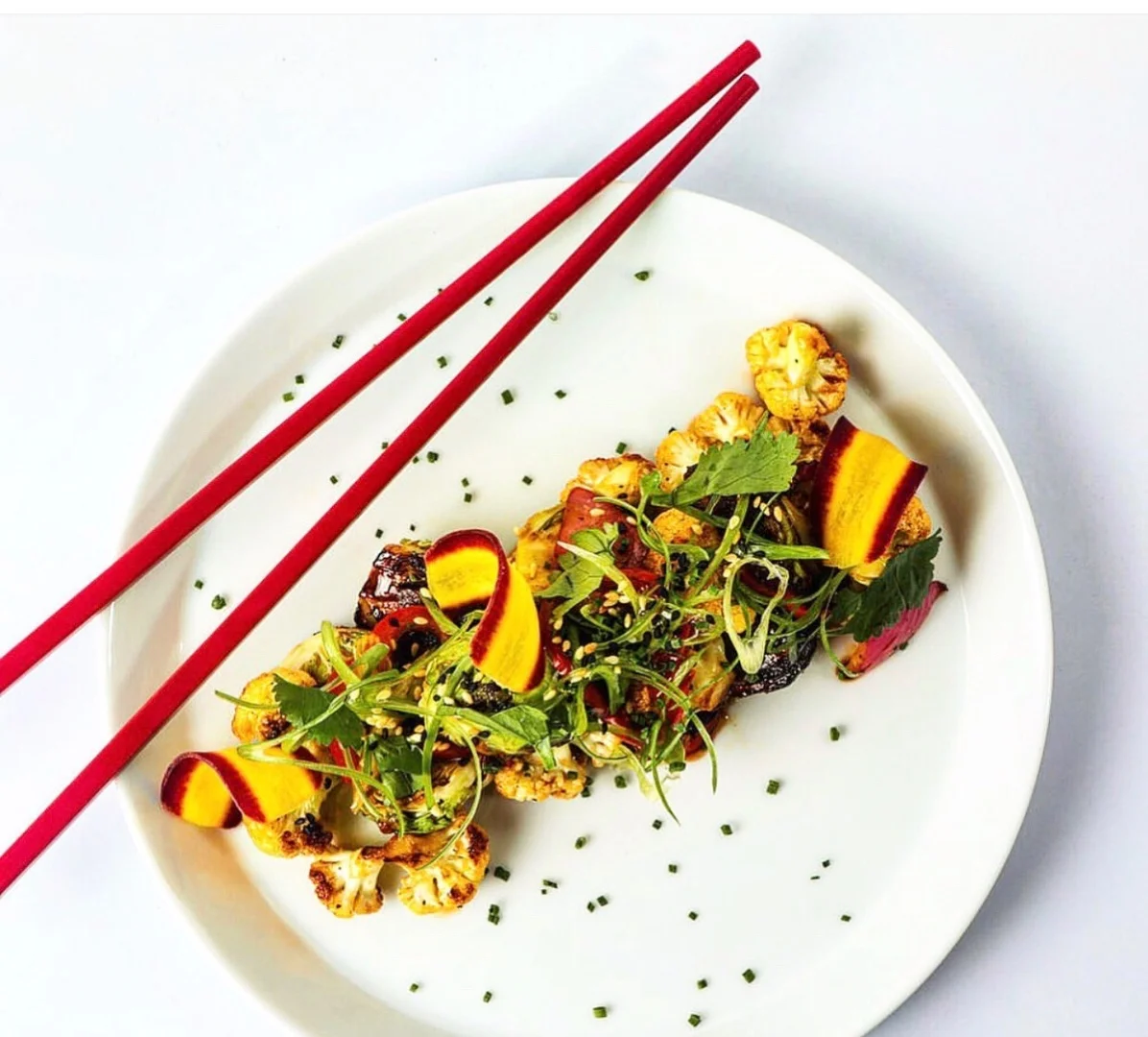 Cauliflower stir fry with chopsticks